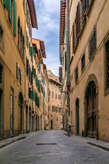 Poster - Gothic buildings on a narrow street in Centro Storico of Florence, Italy