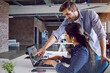 © A.B./peopleimages.com - Team, laptop and web designer at startup with partnership, help and webdesign, work together and digital marketing. Meeting, man and woman at modern office with collaboration, strategy and internet