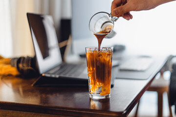 Wall Mural - iced coffee on desk at home