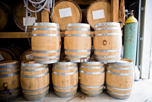 Whiskey Barrels Sit In A Distillery