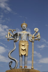 Wall Mural - Vishnu statue over a Battambang crossroads. Cambodia.