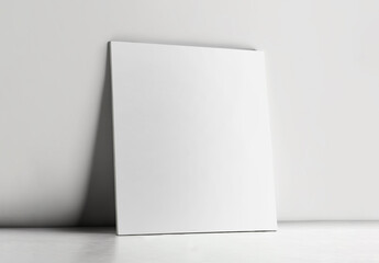 Poster - Blank Canvas or Poster Mockup Against Grey Wall Background.