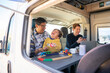 © Westend61 - Happy son enjoying with parents in camper van