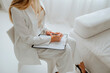 © Westend61 - Mental health professional taking notes during a counseling session