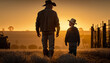 A farmer and his son in a sunset agricultural landscape