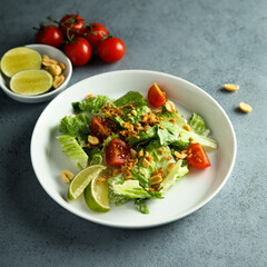 Canvas Print - Healthy green salad with cherry tomatoes and peanut