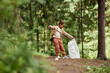 © Seventyfour - Full length portrait of black little girl picking up plastic bottles in nature trail, copy space