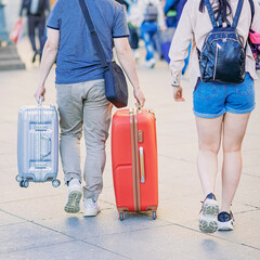  Abstract couple of travelers with luggage, suitcases and backpack, concept of travel and tourism concept