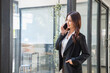 © PHAISITSAWAN - Marketing, Financial, Accounting, Planning, businesswoman uses a mobile phone to contact a customer to inform her of the company is business partnership.