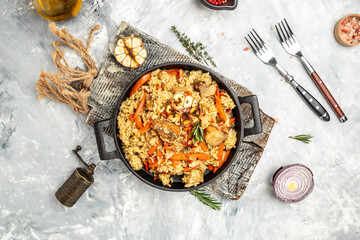 plate of pilaf. traditional Uzbek dish. rice with vegetables. banner, menu, recipe place for text, top view