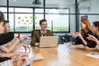 © kanpisut - Diverse colleagues gather in brainstorm discuss statistics together. Group of people colleagues gather doing Brainstorming business plan together. Team Brainstorm Working Concept.