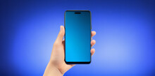 One hand holding a smartphone / Mobile phone with blank display and camera / Blue + Black/ Ideal for a presentation + decoration / Neutral background / Space for text / Blank text / Copy space
