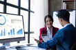 © Natee Meepian - Young Asian business team creative businesspeople coworker in office. Meeting Presentation for tax analysis graph company financial. People Work in Business Office