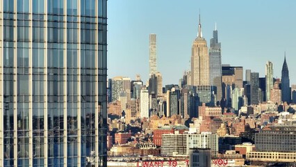 Wall Mural - Midtown Manhattan with Empire State Building - aerial reveal shot - drone photography