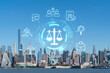 New York City skyline from New Jersey over the Hudson River towards Midtown Manhattan at day time. Glowing hologram legal icons. The concept of law, order, regulations and digital justice