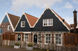 © drew - picturesque residential houses in the Dutch fishing village of Urk in Netherlands. iconic archicture of buildings in holland more specific to Flevoland. Coastal homes where local people live