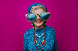 © VISTA by Westend61 - Happy wearing oversized sunglasses against pink background
