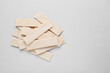 Many sticks of tasty chewing gum on light grey background, flat lay. Space for text