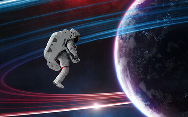 Wall Mural - astronaut in outer space in front of distant inhabited planet. science fiction. elements of this ima