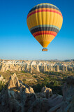 Fototapeta Góry - Cappadocia, Hot air balloon is flying over amazing landscape, Travel destination in Turkey