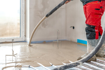 Wall Mural - installation of liquid concrete on the floor for underfloor heating