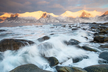 Wall Mural - Snow covered mountain range on coastline in winter, Norway. Senja panoramic aerial view landscape nordic snow cold winter norway ocean cloudy sky snowy mountains. Troms county, Fjordgard 