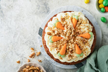 Easter Carrot Cake With Cream Cheese Frosting. Delicious Carrot Cake With Walnut And Cream Cheese Frosting On Gray Concrete Background Table For Festive Dinner. Traditional Carrot Cake. Easter Food.