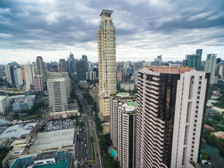 Poster - Manila Cityscape, Makati City with Business Buildings and Cloudy Sky. Philippines. Skyscrapers in Background.