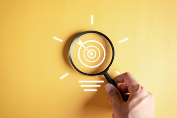 Fototapete - Magnifier glass focus to target objective with idea creative light bulb icon. planning development leadership and customer target group concept...