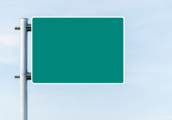 Mockup green road sign with blue sky background