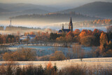 Fototapeta Kwiaty - autumn frosty morning overlooking the church in the valley