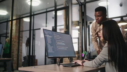 Group of Programmers Working On Big Data Processing In Office, Black Man And Asian Woman Discussing