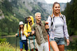 © NDABCREATIVITY - Group of happy friends enjoying outdoor activity together