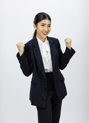 Portrait isolated cutout studio shot Millennial Asian professional successful female businesswoman entrepreneur in formal business suit stand smiling pumping fists up celebrating on white background