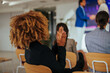 © bernardbodo - Woman applauding in conference.