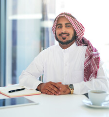 Canvas Print - Here to work hard. Success depends on it. Portrait of a confident young muslim businessman working at his desk in a modern office.