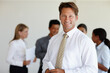 © Laflor/peopleimages.com - Prioritizing my passion. Shot of a mature executive standing infront of a group of colleagues.