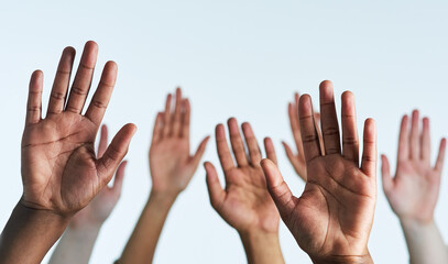 Poster - Raise your hands as one. Shot of a group of hands reaching up against a white background.