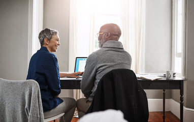 Poster - Are you glad we put that extra money away. Shot of a senior couple working on their finances at home.