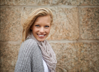 Canvas Print - Warm and stylish. Cropped portrait of a pretty young blonde in warm winter fashion.