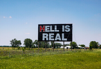 Billboard sign reads Hell is real