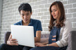 © themorningglory - Business man and woman working in office wioth laptop brainstorm business plan