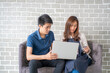 © themorningglory - Business man and woman working in office wioth laptop brainstorm business plan