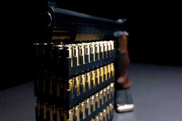 Elegant Semiautomatic 9mm Handgun Leaning on Bullet Ammunition in Switzerland.