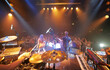 © Yuri A/peopleimages.com - A band playing on stage at a concert- This concert was created for the sole purpose of this photo shoot, featuring 300 models and 3 live bands. All people in this shoot are model released