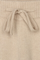 Wall Mural - clothing detail, beige fabric close-up