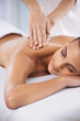 © Mapodile/peopleimages.com - It doesnt get anymore relaxing.... Cropped shot of a beautiful young woman relaxing during spa treatment.