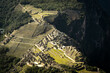 Aerial  above Machu Picchu Valley, Inca Trail, Terraces, Temple, Peru with Andean Cordillera Shining in the Background, UNESCO Protected Site