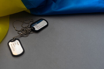 Wall Mural - military ID tag and Ukrainian flag on background. Banner design