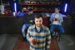 © Serhii - Night in bar. Portrait of cheerful men drinking beer at the bar